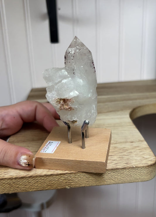 Clear Quartz with Hematite in Stand
